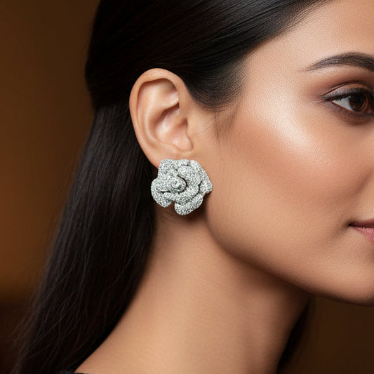 Pair of diamond earrings on a white background