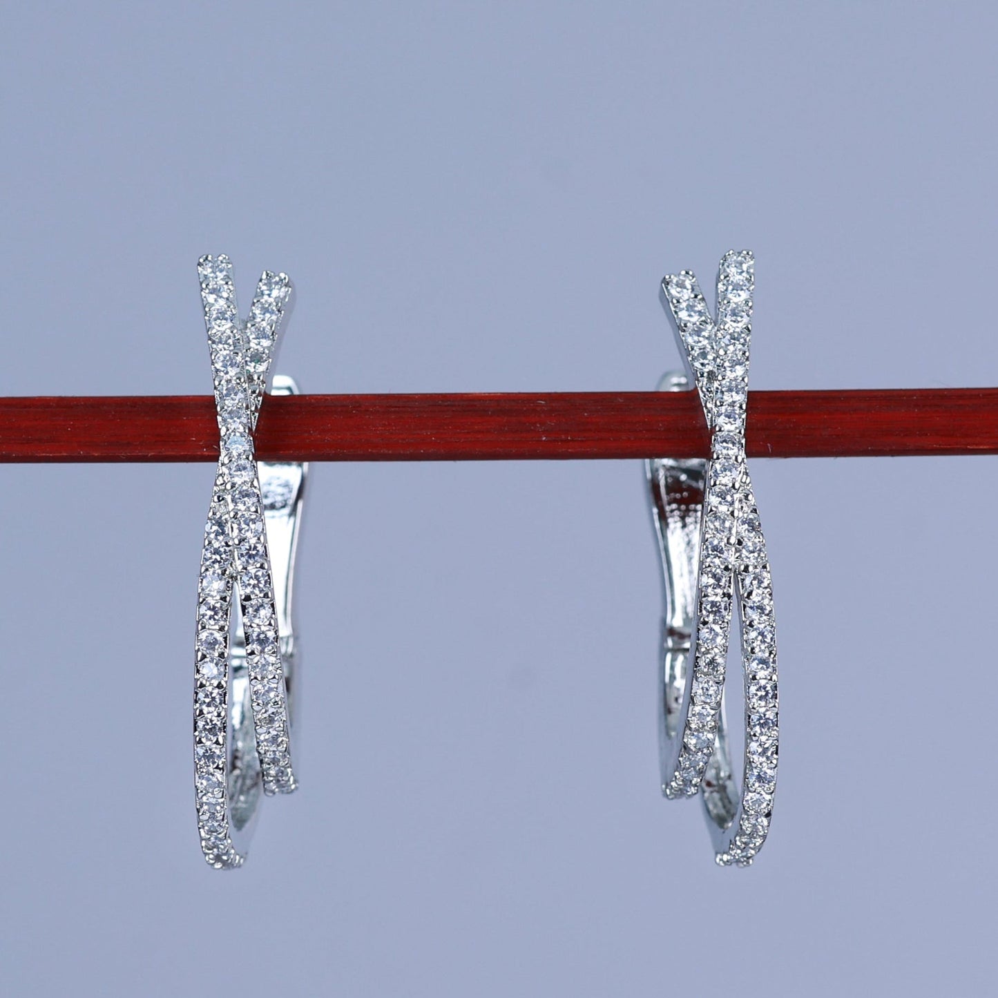 Silver diamond hoop earrings hanging