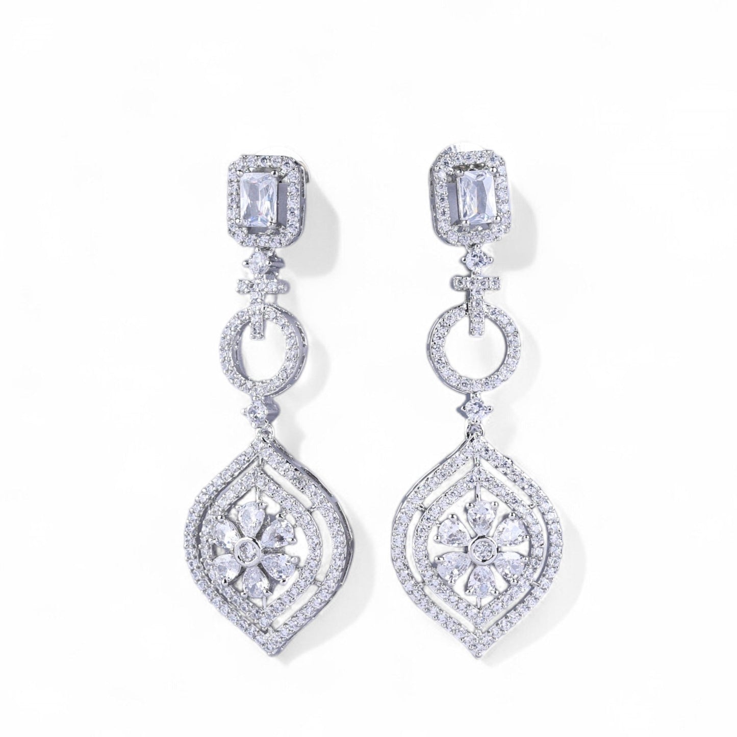 Pair of diamond earrings on a white background