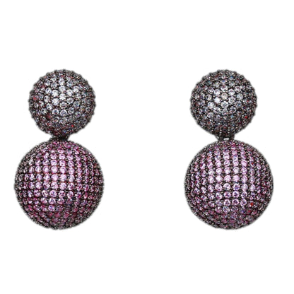 Pair of purple ball earrings on a white background
