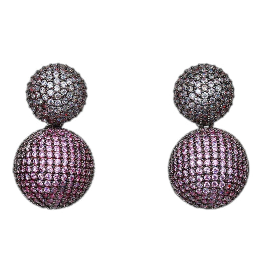 Pair of purple ball earrings on a white background