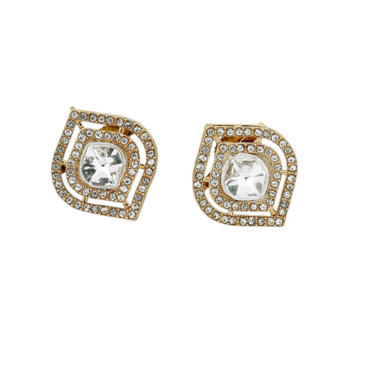 Pair of gold and crystal earrings on a white background