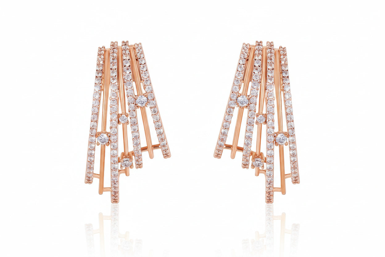 Gold and diamond earrings on a white background