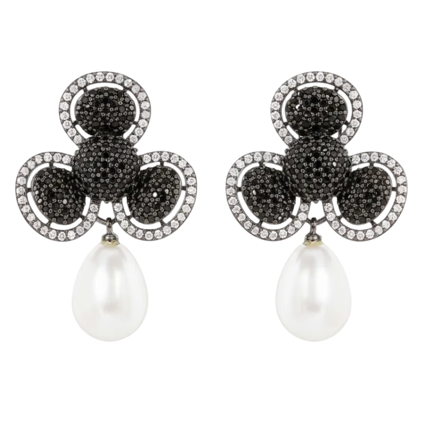Pair of earrings with black gemstones and pearl drops on a white background