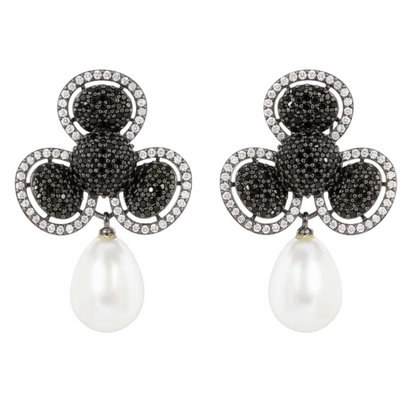 Pair of earrings with black gemstones and pearl drops on a white background