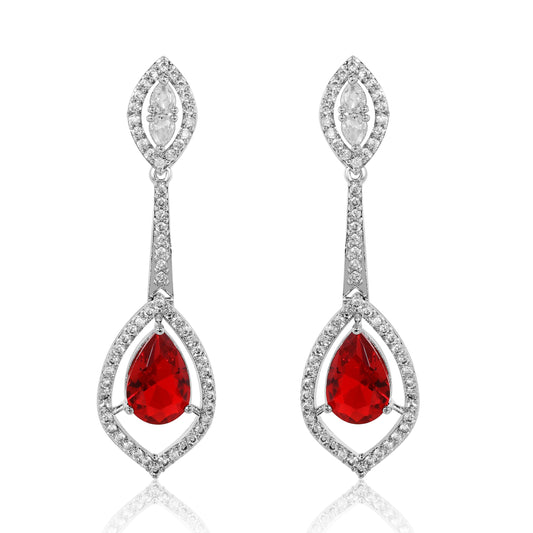 Pair of earrings with red gemstones and diamond-like accents on a white background