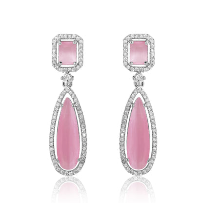 Pair of pink teardrop earrings with silver accents on a white background