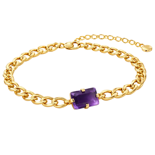 Gold chain bracelet with a purple gemstone on a white background