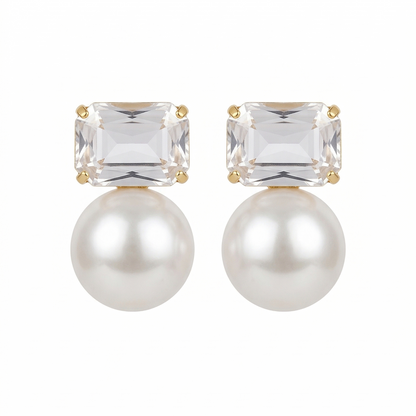 Pair of earrings with clear gemstones and pearls on a white background