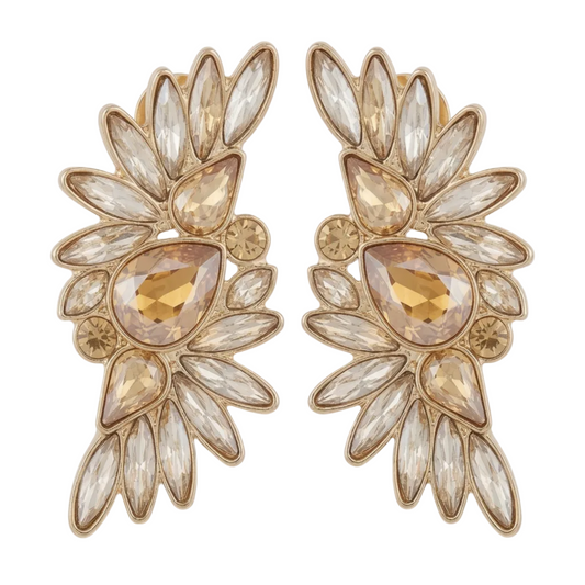 Pair of gold and crystal earrings on a white background