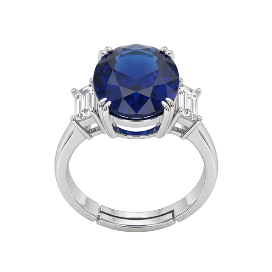 Silver ring with a blue gemstone on a white background