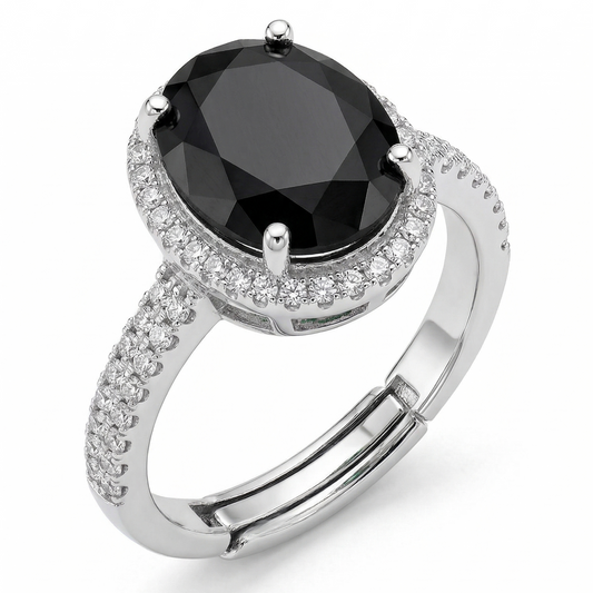 Silver ring with a black gemstone on a white background