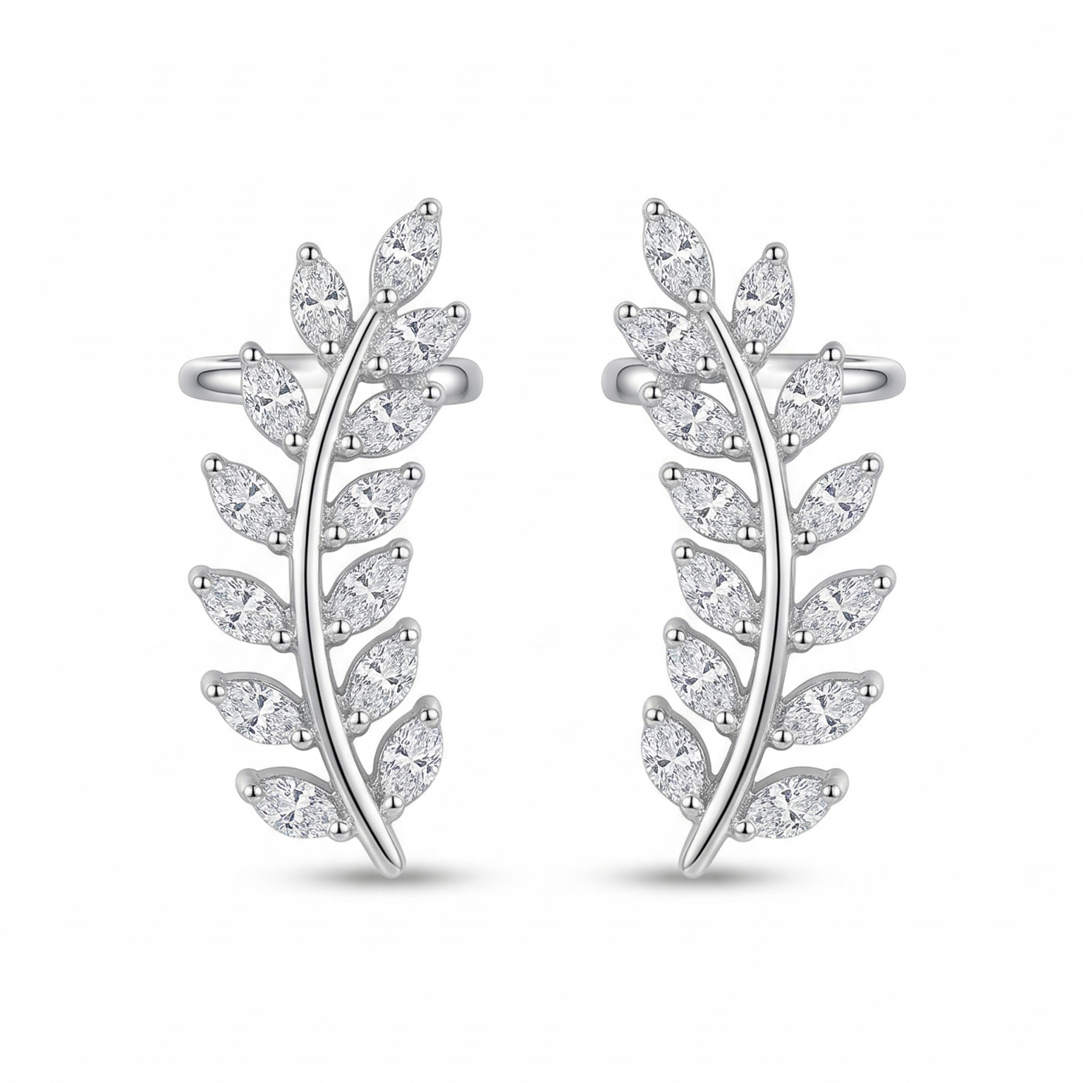 Pair of silver leaf-shaped earrings on a white background