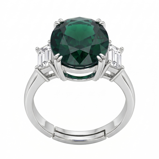 Silver ring with a green gemstone on a white background