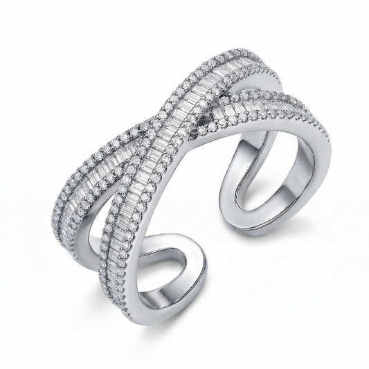Silver ring with intricate design on a white background