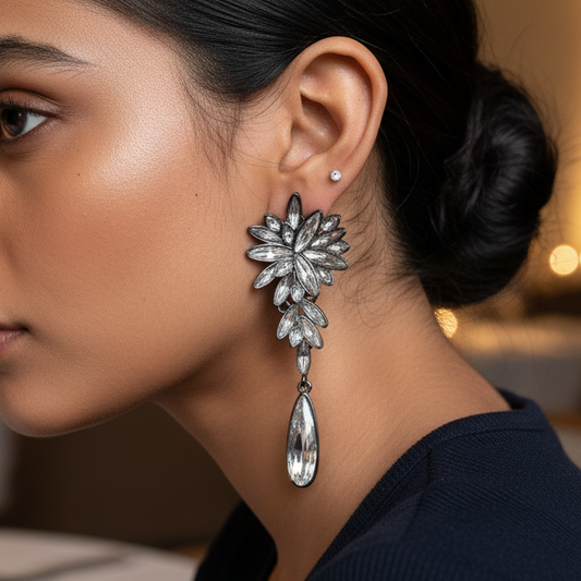 Woman wearing a large, ornate earring in a restaurant setting