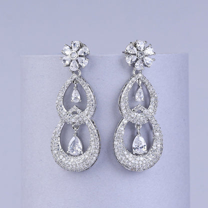Pair of silver earrings with drops and flowers