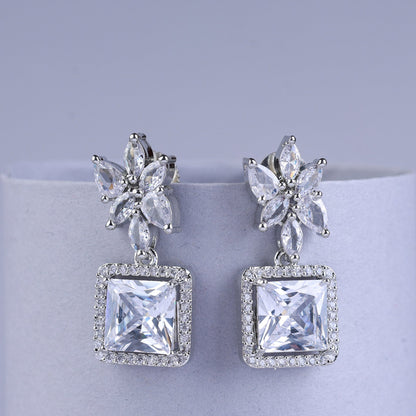 Silver earrings with butterfly designs and square gemstones