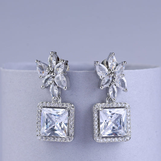 Silver earrings with butterfly designs and square gemstones