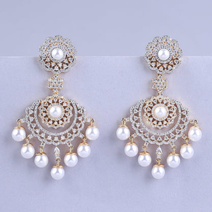 Pair of ornate earrings with pearls 