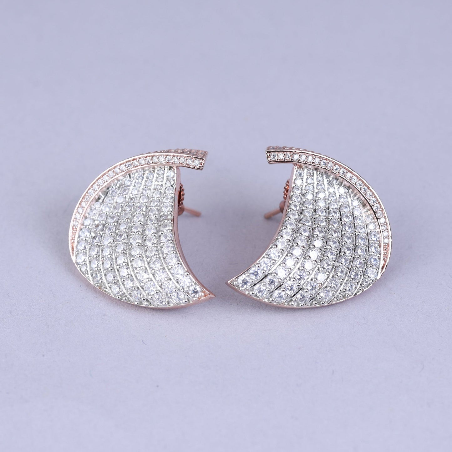 Pair of ornate earrings with pearls 