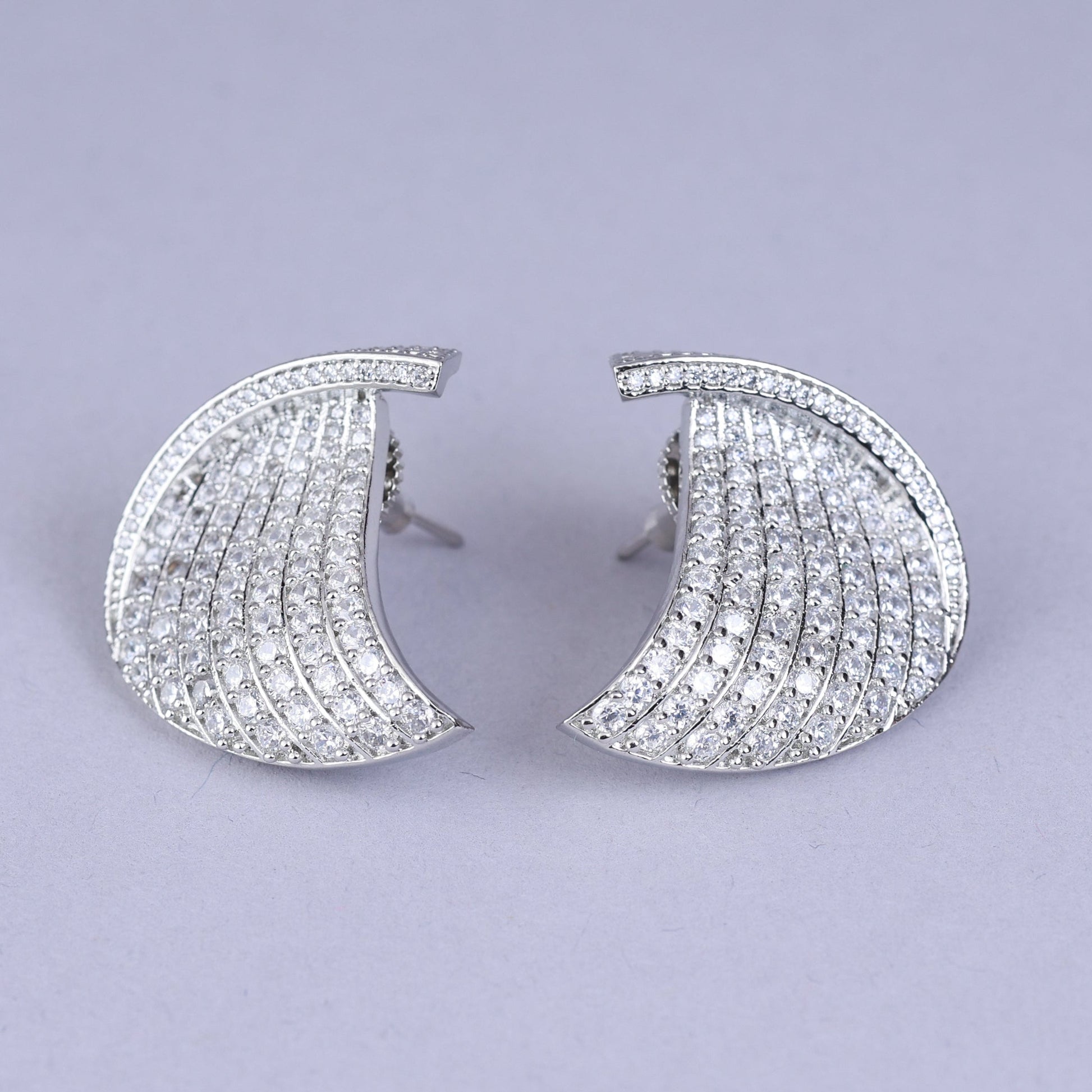 Pair of ornate earrings with pearls 