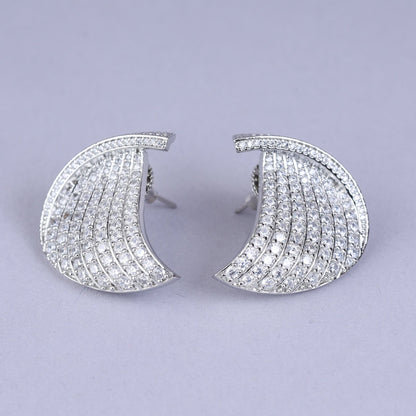 Pair of ornate earrings with pearls 