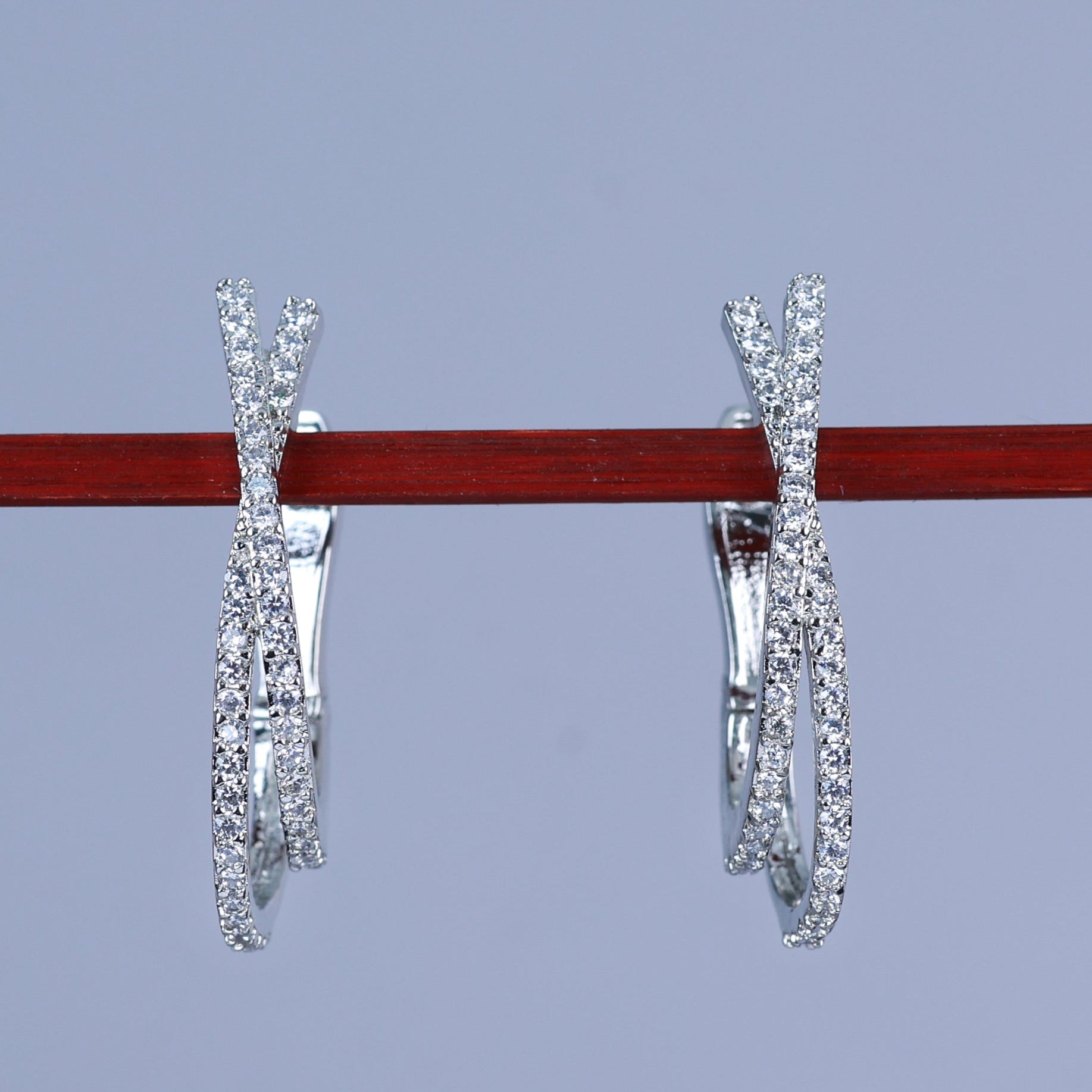 Silver diamond hoop earrings hanging