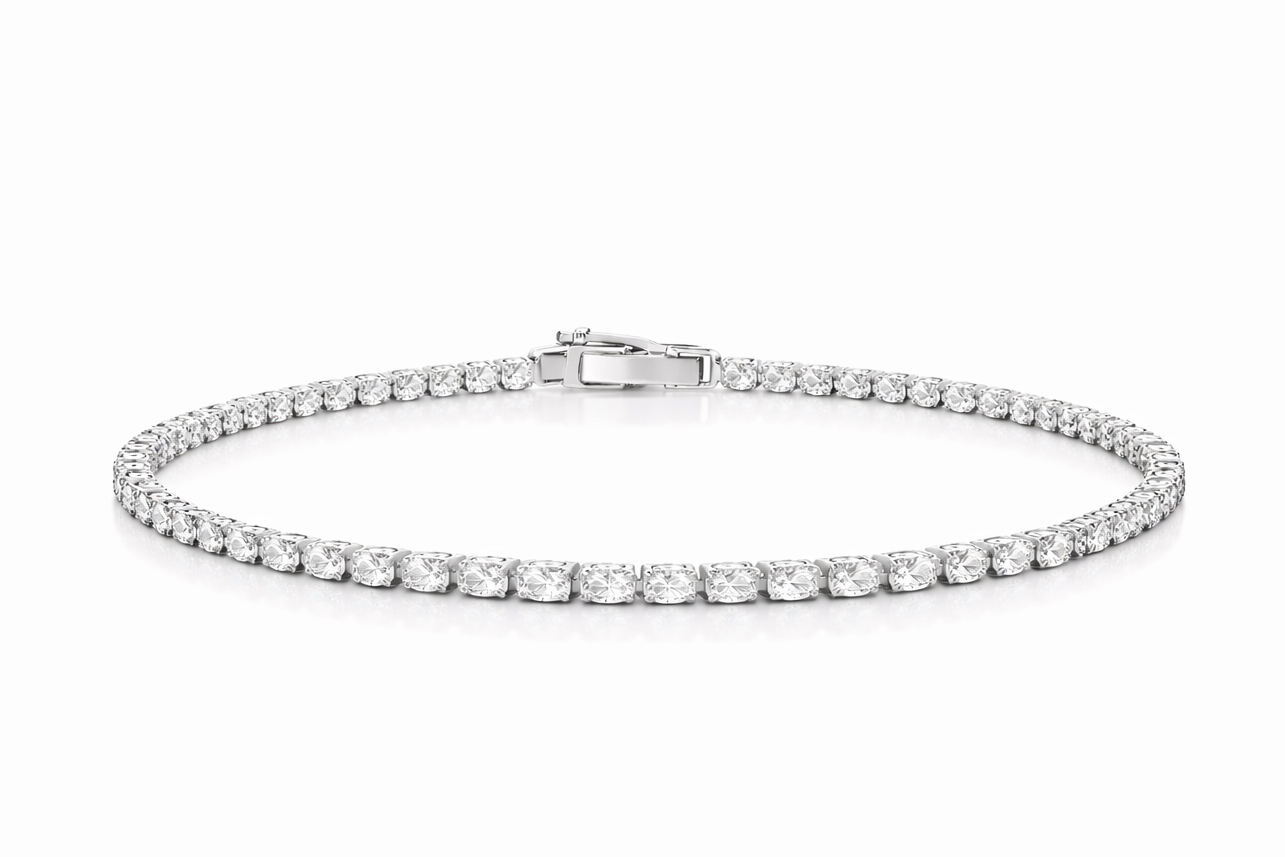 Silver bracelet with clear stones on a white background