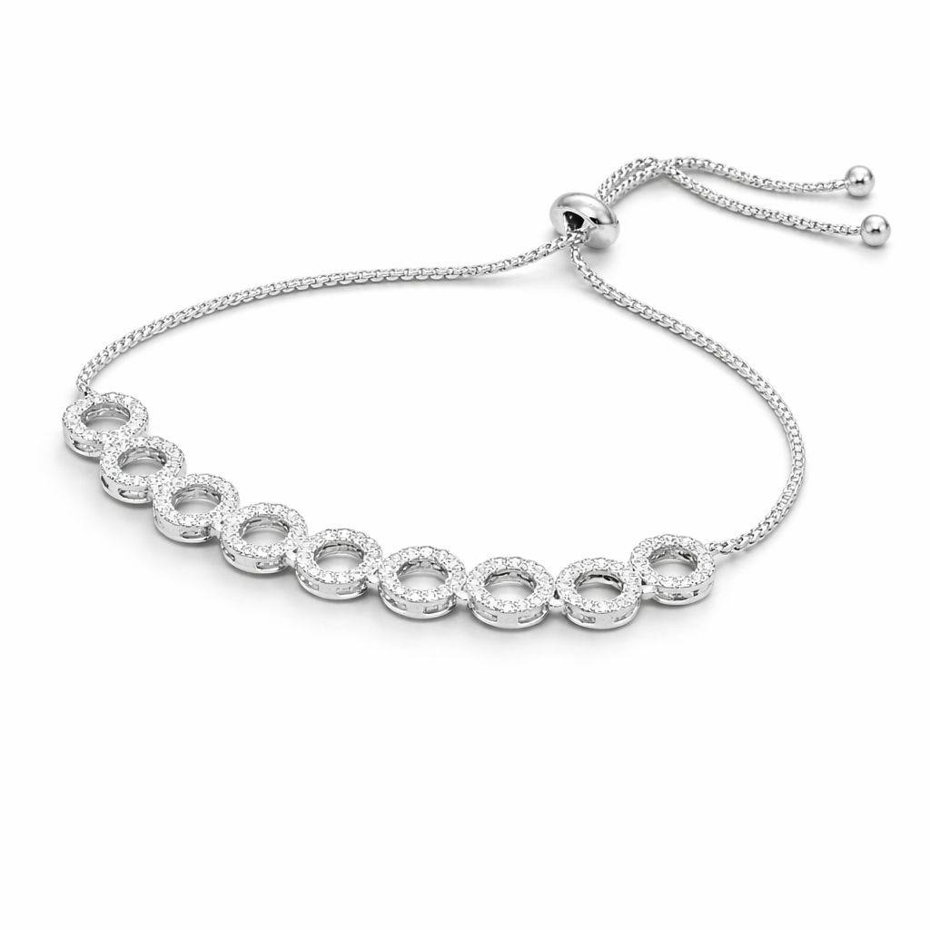 Silver bracelet with clear stones on a white background