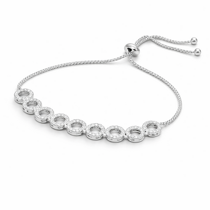 Silver bracelet with clear stones on a white background