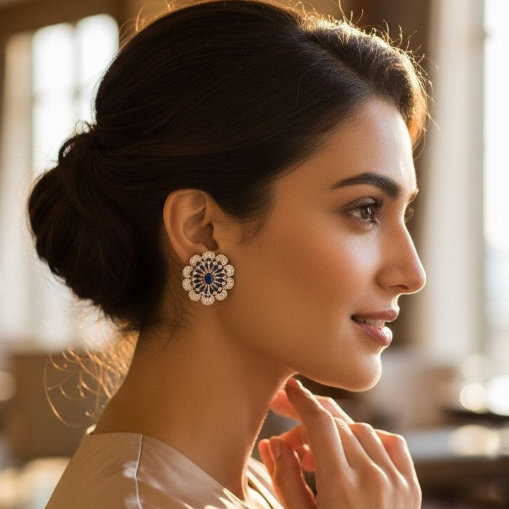 Woman wearing elegant earrings in a softly blurred indoor setting