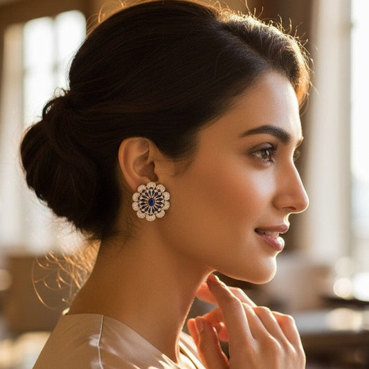 Woman wearing elegant earrings in a softly blurred indoor setting
